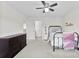 Inviting bedroom featuring a stylish bed, modern decor, and great natural light from a nearby window at 2936 Shumard Dr, Gastonia, NC 28054