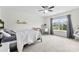 Bright bedroom featuring a bed, a ceiling fan, and a window with scenic views at 2936 Shumard Dr, Gastonia, NC 28054