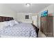 Cozy bedroom with a comfortable bed, natural light, and neutral walls at 2936 Shumard Dr, Gastonia, NC 28054