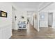 Bright foyer with wood floors, white wainscoting, and a stylish blue accent table at 2936 Shumard Dr, Gastonia, NC 28054