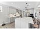 Bright kitchen with stainless steel appliances, white quartz countertops and island seating at 2936 Shumard Dr, Gastonia, NC 28054
