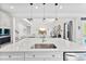 Bright kitchen with stainless steel appliances, white cabinets, and an island overlooking living area at 2936 Shumard Dr, Gastonia, NC 28054
