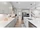 Modern kitchen featuring stainless steel appliances, white quartz counters, and stylish gray cabinetry at 2936 Shumard Dr, Gastonia, NC 28054