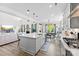 Open kitchen with white quartz countertops, stainless appliances, and an island overlooking the Gathering room at 2936 Shumard Dr, Gastonia, NC 28054