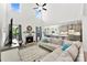 Spacious living room with fireplace, open layout to kitchen, and large windows providing ample light and modern comfort at 2936 Shumard Dr, Gastonia, NC 28054