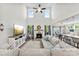 Bright, open living area featuring a fireplace, high ceilings, and seamless flow into the dining and kitchen spaces at 2936 Shumard Dr, Gastonia, NC 28054