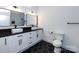 Bathroom features double vanity with sleek black hardware, modern fixtures, and black hexagon tile at 3007 West Blvd, Charlotte, NC 28208