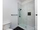 A modern tiled shower, black fixtures, and black hexagon tile make up this lovely bathroom at 3007 West Blvd, Charlotte, NC 28208