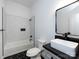 Bathroom featuring tiled walls, and a vanity with black fixtures at 3007 West Blvd, Charlotte, NC 28208