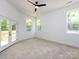 Bright bedroom with ceiling fan and glass doors leading to an outdoor deck at 3007 West Blvd, Charlotte, NC 28208