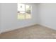Carpeted bedroom with a large window with lots of natural light at 3007 West Blvd, Charlotte, NC 28208