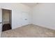 Bright bedroom featuring plush carpeting and a closet with double doors at 3007 West Blvd, Charlotte, NC 28208
