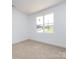 Carpeted bedroom with large window with lots of natural light at 3007 West Blvd, Charlotte, NC 28208