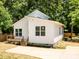 Charming home boasts a modern design, natural light, and a lovely wooden deck at 3007 West Blvd, Charlotte, NC 28208