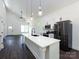 Modern kitchen with a spacious island, sleek appliances, and ample cabinet space at 3007 West Blvd, Charlotte, NC 28208
