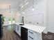 Spacious kitchen area featuring modern appliances, an island with sink, and stylish lighting at 3007 West Blvd, Charlotte, NC 28208