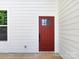 Side door featuring paneled design, contrasting color, and wood deck flooring at 3007 West Blvd, Charlotte, NC 28208