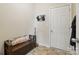 Cozy entryway with storage bench, decorative pillow, and door to the outside at 314 Pulaski Sw Dr, Concord, NC 28027