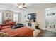Relaxing living room with cozy seating, bright lighting, and views of a laundry room at 314 Pulaski Sw Dr, Concord, NC 28027