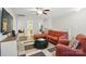 Cozy living room with ample seating, a TV, and a view to another room at 314 Pulaski Sw Dr, Concord, NC 28027