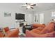 Comfortable living room featuring a plush sectional, cozy armchairs, and a modern media center at 314 Pulaski Sw Dr, Concord, NC 28027
