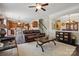 Open-concept layout featuring a living room and kitchen with hardwood floors and stylish furnishings at 314 Pulaski Sw Dr, Concord, NC 28027