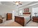 A beautifully furnished main bedroom features a trey ceiling, neutral decor, and plenty of natural light at 314 Pulaski Sw Dr, Concord, NC 28027