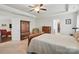 Spacious main bedroom with a trey ceiling, access to the main bathroom, and walk-in closet at 314 Pulaski Sw Dr, Concord, NC 28027