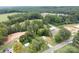 Aerial view of the property showing the house, yard, surrounding trees, and neighborhood at 3430 Stokes Ferry Rd, Salisbury, NC 28146