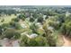 An elevated view showcasing the home, the driveway, the lawns, the trees, and the community at 3430 Stokes Ferry Rd, Salisbury, NC 28146