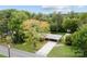 Aerial view showcases home with a covered parking area and lush tree coverage at 3430 Stokes Ferry Rd, Salisbury, NC 28146