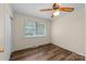 Cozy bedroom featuring a ceiling fan, window, and neutral wall color at 3430 Stokes Ferry Rd, Salisbury, NC 28146