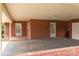 Spacious carport area featuring brick walls, multiple entry doors, and ample parking space at 3430 Stokes Ferry Rd, Salisbury, NC 28146
