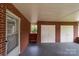 Large carport area featuring brick walls, multiple entry doors, and ample storage at 3430 Stokes Ferry Rd, Salisbury, NC 28146