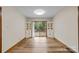 Dining room featuring wood-look vinyl flooring, and access to a deck through sliding glass doors at 3430 Stokes Ferry Rd, Salisbury, NC 28146