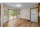 Dining room with deck access, built in cabinets, and wood-look vinyl flooring at 3430 Stokes Ferry Rd, Salisbury, NC 28146