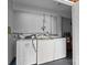 Functional laundry room with washer and dryer hookups and a white-painted brick wall at 3430 Stokes Ferry Rd, Salisbury, NC 28146