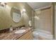 Well-lit bathroom features an oval mirror and a combined shower and tub with a glass door at 4020 Barclay Downs Dr, Charlotte, NC 28209
