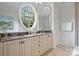 Bathroom with double sinks and an oval window at 4020 Barclay Downs Dr, Charlotte, NC 28209