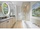 Bright bathroom with double sink vanity, garden tub and shower at 4020 Barclay Downs Dr, Charlotte, NC 28209