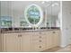 Bathroom features double sinks and an oval window at 4020 Barclay Downs Dr, Charlotte, NC 28209
