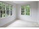 Light-filled bedroom featuring natural light and white trim at 4020 Barclay Downs Dr, Charlotte, NC 28209