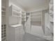 Spacious walk-in closet features built-in shelving and ample storage at 4020 Barclay Downs Dr, Charlotte, NC 28209