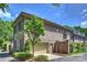 Brick home exterior with a two-car garage, well-maintained landscaping, and a brick privacy wall at 4020 Barclay Downs Dr, Charlotte, NC 28209