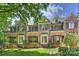 Charming brick townhomes with manicured lawns and beautiful landscaping, creating inviting curb appeal at 4020 Barclay Downs Dr, Charlotte, NC 28209