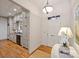Foyer featuring a white door with an adjacent butler's pantry offering convenient service and storage at 4020 Barclay Downs Dr, Charlotte, NC 28209