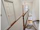 Upstairs hallway with stairwell and view into the living room at 4020 Barclay Downs Dr, Charlotte, NC 28209
