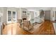 Elegant living room with a fireplace, French doors, and hardwood floors at 4020 Barclay Downs Dr, Charlotte, NC 28209