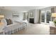Expansive main bedroom featuring a fireplace and French doors with serene natural views at 4020 Barclay Downs Dr, Charlotte, NC 28209
