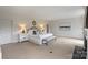 Spacious main bedroom with fireplace, neutral decor, and ample natural light at 4020 Barclay Downs Dr, Charlotte, NC 28209